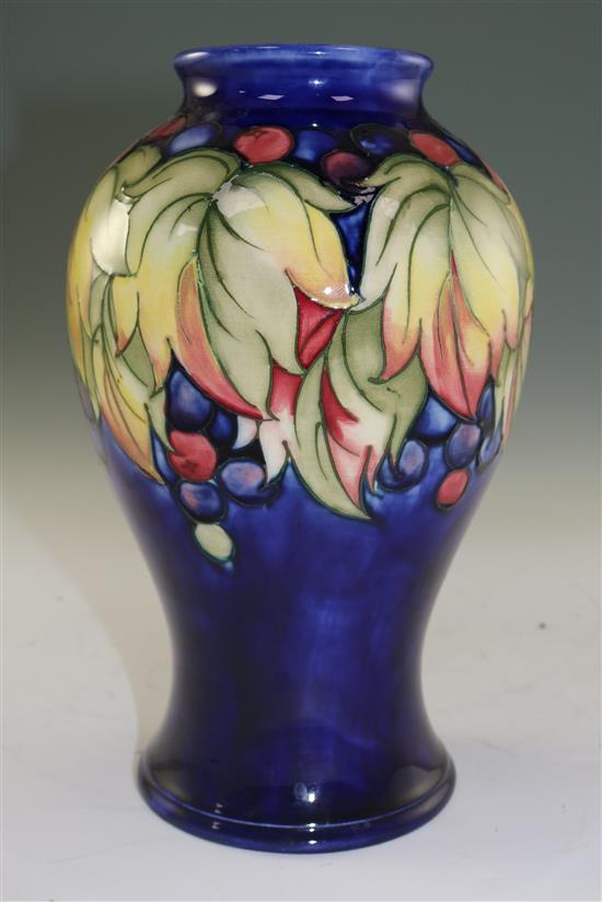 A Moorcroft leaf and berry pattern baluster vase, mid 20th century, 23.5cm (9.25in.)